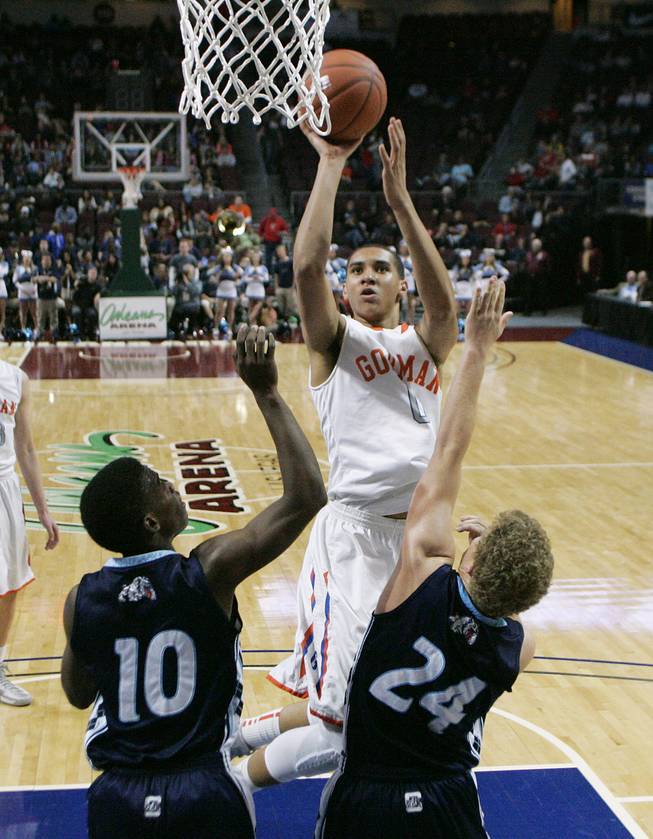 Bishop Gorman's Chase Jeter shoots over Centennial's Marcus Allen (10) and Austin Turley (24) during their Division I state championship game Friday, Feb. 22, 2013 at the Orleans. Gorman won 69-43.