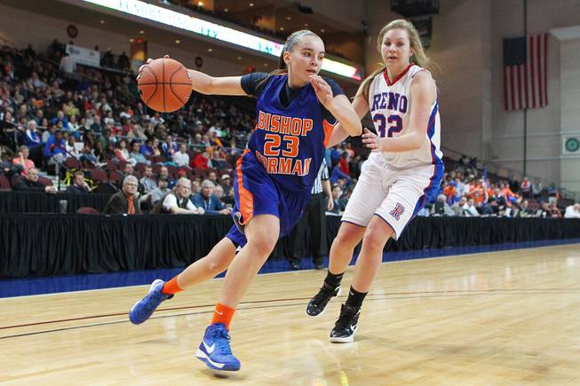 Bishop Gorman's Megan Jacobs makes her move to the basket past Reno's Morgan McGwire during their Division I state championship game Friday, Feb. 22, 2013 at the Orleans. Reno won 52-39.