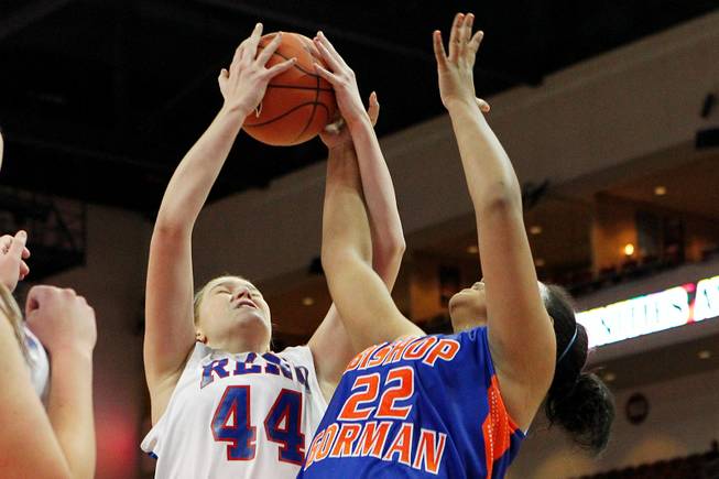 Bishop Gorman's Raychel Stanley and Reno's Mallory McGwire contest a rebound during their Division I state championship game Friday, Feb. 22, 2013 at the Orleans. Reno won 52-39.