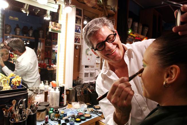 Roger Stricker, the wigs and makeup supervisor at "Zumanity," tests the "One Night for One Drop" makeup for performer Gyulnara Karaeva inside the "Zumanity" hair and makeup room at New York New York Hotel & Casino in Las Vegas on Tuesday, February 26, 2013.