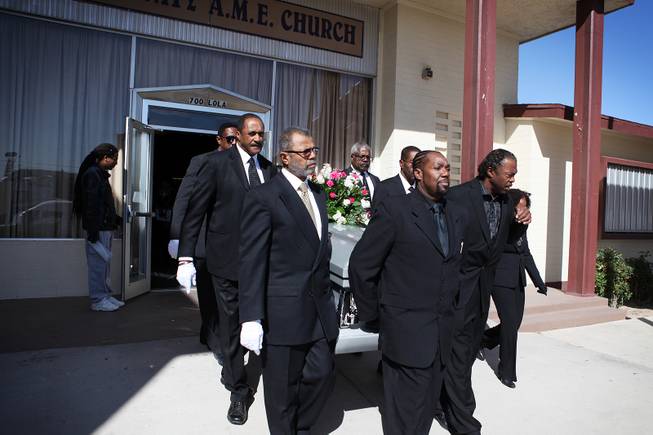 Pallbearers carry the coffin out of the church after the memorial service for Michael Boldon at Holy Trinity AME Church in North Las Vegas on Wednesday, Feb. 27, 2013. Boldon was killed in his cab Feb. 21, the result of a fiery crash after a shootout on the Las Vegas Strip.