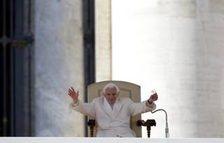 Pope Benedict XVI waves to faithful during his final general audience in St.Peter's Square at the Vatican, Wednesday, Feb. 27, 2013. Pope Benedict XVI has recalled moments of 