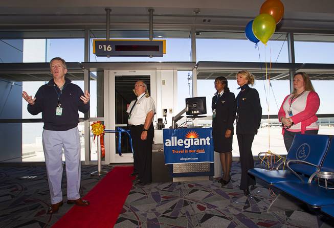 Maurice J. Gallagher Jr., left, chairman/CEO of Allegiant Air, speaks to employees waiting to get their first look at a new Airbus A319 passenger jet at McCarran International Airport Thursday, Feb. 28, 2013. The new jet is more fuel efficient than the company's current jets.