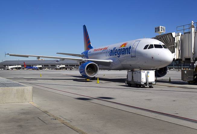 A new Allegiant Air Airbus A319 passenger jet is parked at a gate at McCarran International Airport Thursday, Feb. 28, 2013. The new jet is more fuel efficient than the company's current jets.