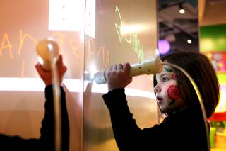Angeline Schmitz, 5, makes digital drawings inside the Young At Art section of the museum during the donor ceremony and celebration at the new Discovery Children's Museum located in Symphony Park in Las Vegas on Friday, March 1, 2013.