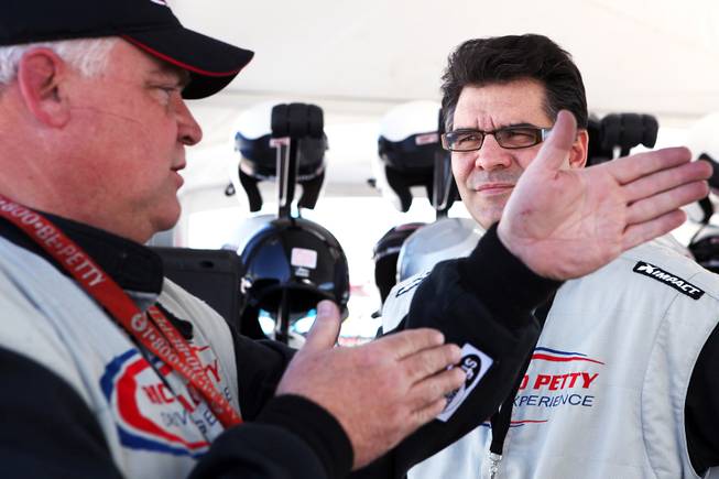 John Katsilometes gets some racing tips from driving instructor Mike VanNatta, left, at the Richard Petty Driving Experience at Las Vegas Motor Speedway on Friday, March 1, 2013.