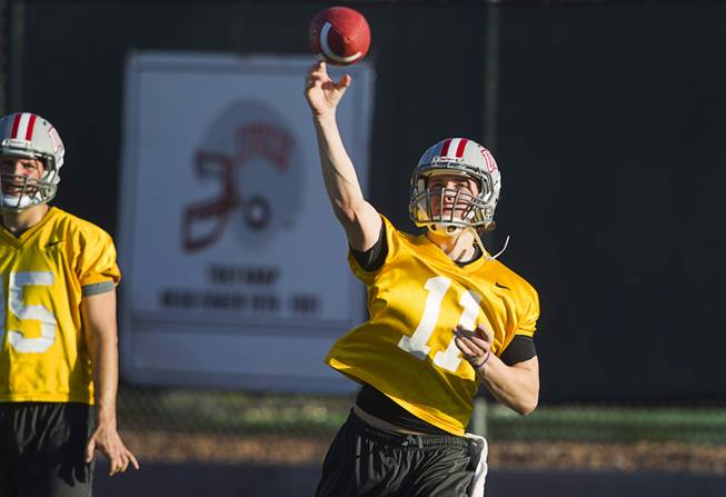 Quarterback Troy Hawthorne passes during practice at Rebel Park at UNLV Monday, March 4, 2013.