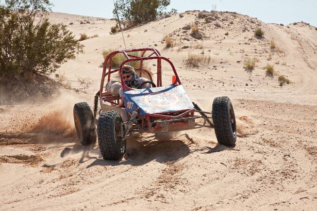 A driver is seen racing in a one-seater dune buggy during one of the racing adventures offered by the Las Vegas Desert Racing Academy.