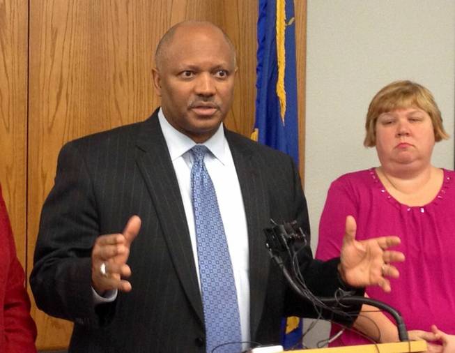 Clark County Schools Superintendent Dwight Jones answers questions today from media about his resignation, which he announced via email Tuesday, March 5, 2013. Jones reiterated that he was leaving to take care of his ailing mother. School board member Deanna Wright is at right.