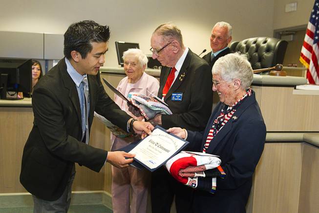Eric Guideng, representing Congressman Joe Heck, gives certificates of recognition to World War II veterans during Veterans Court in Henderson Thursday, March 7, 2013. From left are: Navy veteran Evie Hallas, Army veteran Richard Zimpfer and Coast Guard veteran Billie D'Entremont.