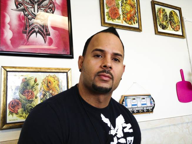 Ron Gonzalez, a tattoo artist at Rock Star Tattoos, Wednesday, Mar. 6, 2013.