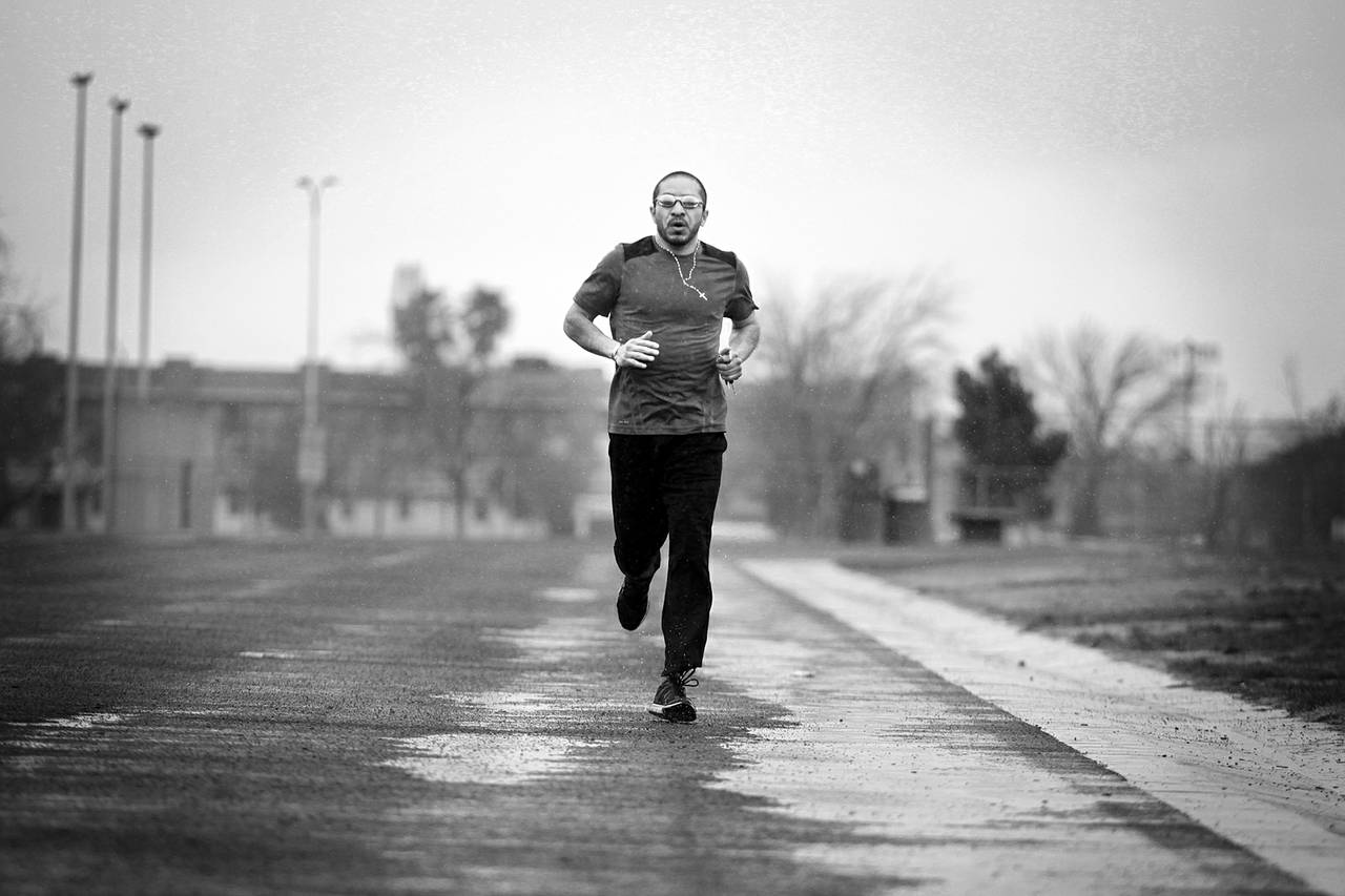 Arturo Martinez-Sanchez runs on a track at the Cheyenne Sports Complex in North Las Vegas on the morning of March 8, 2013. Because of a traumatic brain injury in April 2012, he has only recently begun running again.