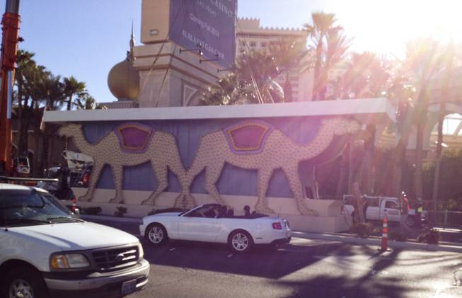 A construction crew prepares to take apart a piece of the Sahara sign during the dismantling of the casino sign, Tuesday, Mar. 12, 2013.
