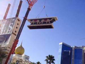 A crane lowers part of the Sahara sign during the dismantling of the casino sign, Tuesday, Mar. 12, 2013.
