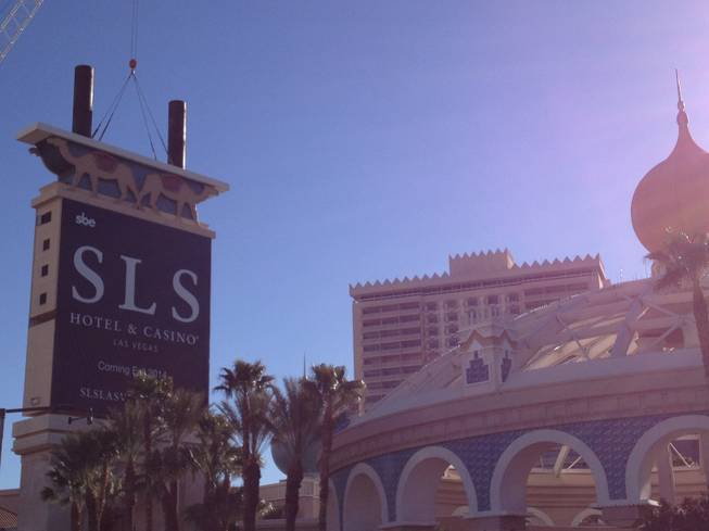 A crane lowers a portion of the Sahara sign Tuesday, March 12, 2013 as part of a project to
transform the iconic Las Vegas casino into the SLS Las Vegas resort. A
portion of Las Vegas Boulevard was closed as work was under way to remove
the sign.
