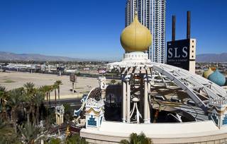 Workers demolish the old porte cochere at the SLS Las Vegas resort, formerly the Sahara, Wednesday, March 13, 2013. The renovated resort is expected to open in the fall of 2014.