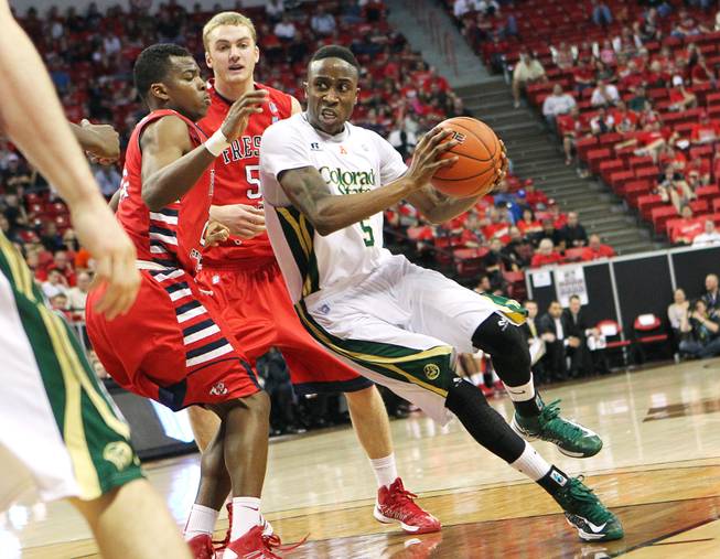 Colorado State guard Jon Octeus drives past Fresno State guard Allen Huddleston during their Mountain West Conference Tournament game Wednesday, March 13, 2013 at the Thomas & Mack. CSU won the game 67-61 and will face UNLV on Friday.