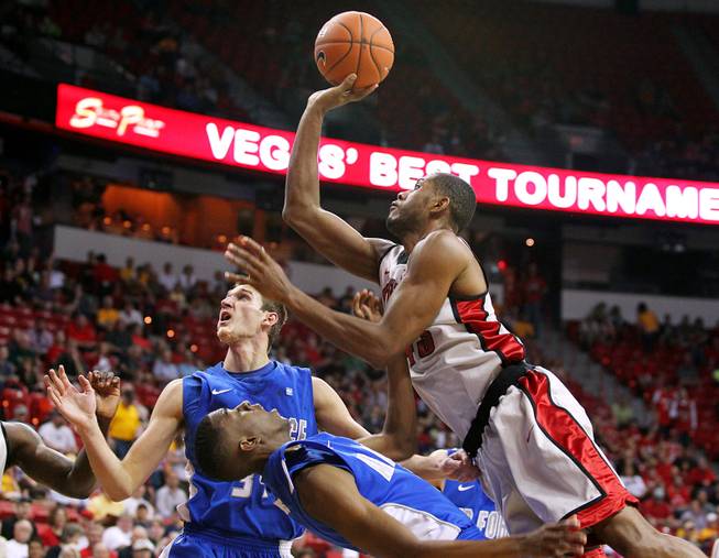 UNLV forward Mike Moser takes a shot over Air Force forward Justin Hammonds during their Mountain West Conference Tournament game Wednesday, March 13, 2013 at the Thomas & Mack. UNLV won 72-56 and will face the winner of the Fresno State vs. Colorado State on Friday.