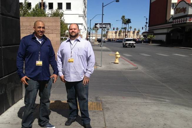 Downtown Rangers Dave Lawson, left, and supervisor Jesse Hammond pose for a photo near the Beat coffee shop, Wednesday, Mar. 13, 2013.