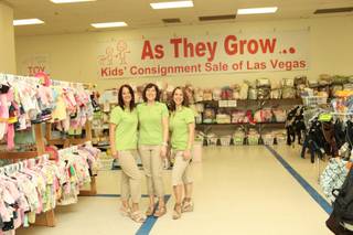 From left: Lisa Renteria, Lisa DeLuca and Leslie Stewart owners of As They Grow pose for a photo during their spring sale, March 13, 2013.