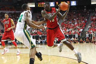 UNLV forward Anthony Bennett is defended by Colorado State forward Greg Smith during their Mountain West Conference Tournament game Friday, March 15, 2013 at the Thomas & Mack Center.