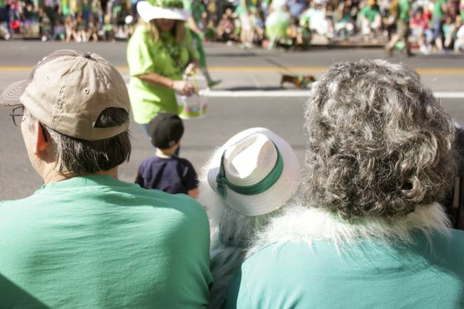 Onlookers watch as the Las Vegas Hot-Diggity Dachshund Club & Rescue passby during the St. Patrick's Day Parade in downtown Henderson, Saturday, Mar. 16, 2013.