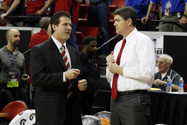 UNLV coach Dave Rice and New Mexico coach Steve Alford talk before the start of their Mountain West Conference Tournament championship game Saturday, March 16, 2013 at the Thomas & Mack Center. 