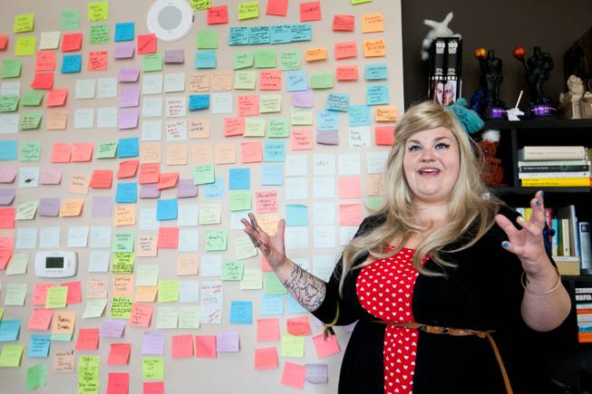Krissee Danger gets excited talking about the Post-it note inspiration wall as she leads attendees through Tony Hsieh's high-rise apartment in the Ogden Hotel as part of the Downtown Project Tour in Las Vegas Wednesday, March 20, 2013.