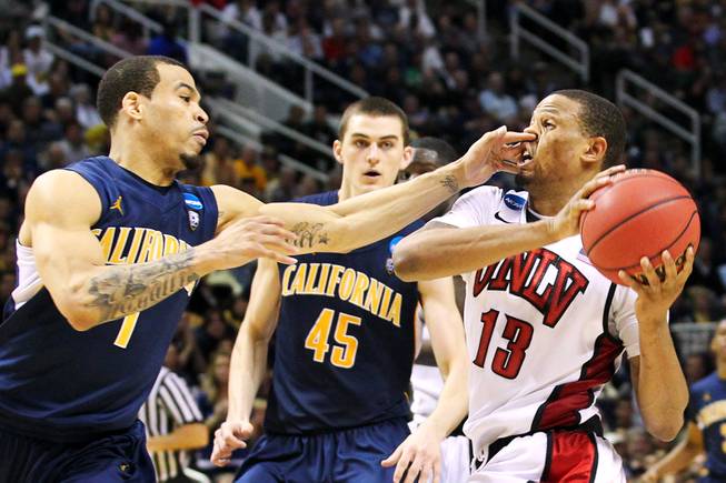 UNLV guard Bryce Dejean-Jones gets a finger in his nose, and a flagrant foul, from Cal guard Justin Cobbs during their second round game at the NCAA Basketball Tournament Thursday, March 21, 2013 at the HP Pavilion in San Jose, Calif. UNLV lost to Cal 64-61 to exit the tournament after one game for the fourth year in a row.