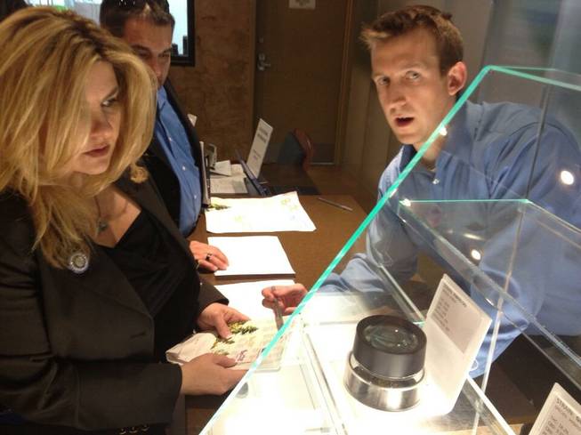 Nevada Assemblywoman Michele Fiore inspects the product and learns about the different uses for and varieties of marijuana during a trip to a dispensary in Arizona on Friday, March 22, 2013.