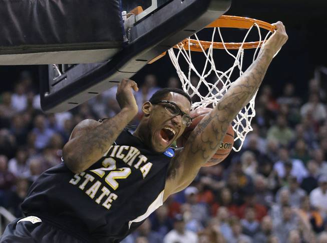 Wichita State's Carl Hall dunks the ball in the first half during a third-round game against Gonzaga in the NCAA men's college basketball tournament in Salt Lake City, Saturday, March 23, 2013.
