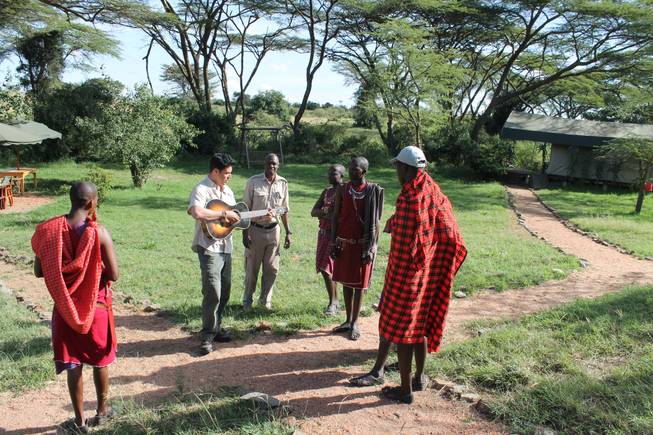 Frankie Moreno gives direction to the staff at Ol Kinyei Conservancy, including Porini Camp manager Harry Maina, for a video of the song "Lions Den."