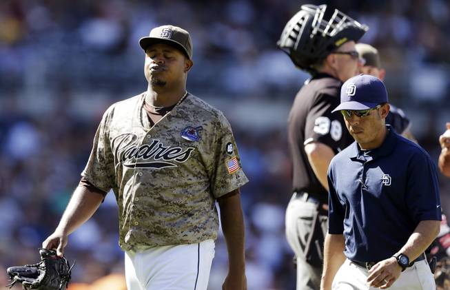 San Diego Padres starting pitcher Edinson Volquez reacts as he leaves the field while playing the San Francisco Giants during the fifth inning in a baseball game in San Diego, Sunday, Sept. 30, 2012. The Giants won 7-5.