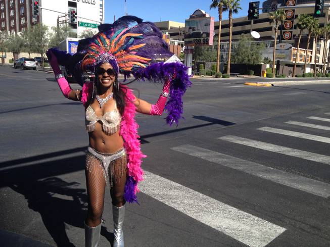 “Fremont Street is on the rise, baby!” said Cassandra Rachal, dressed in a showgirl outfit and hoping to pose for photos with tourists for tip money in the Fremont East Arts District. 
