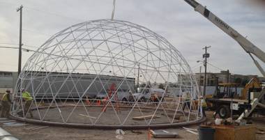 Workers put together the geodesic dome that will top the Downtown Project’s Container Park at Seventh and Fremont streets.