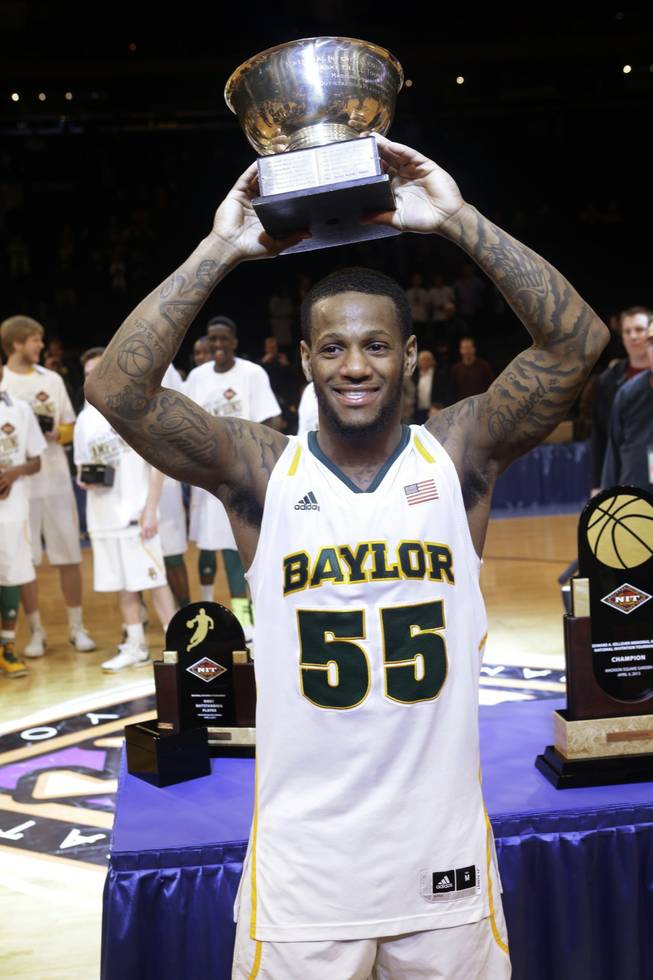 Baylor's Pierre Jackson holds the most valuable player trophy after the NIT championship basketball game against Iowa on Thursday, April 4, 2013, in New York. Baylor won 74-54. 