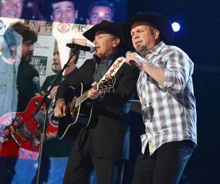 George Strait and Garth Brooks perform during the 2013 Academy of Country Music Awards at MGM Grand Garden Arena on Sunday, April 7, 2013.