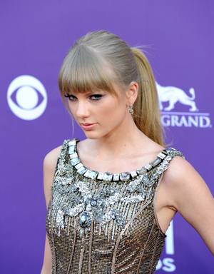 Taylor Swift arrives at the 2013 Academy of Country Music Awards at MGM Grand Garden Arena on Sunday, April 7, 2013.