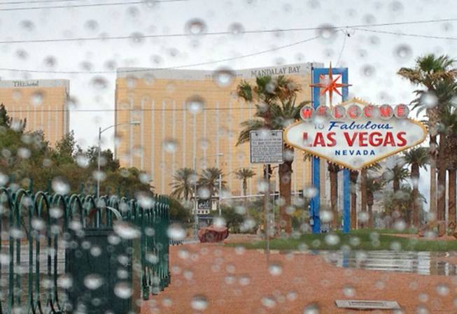 Rain falls on the Las Vegas Strip Monday, April 8, 2013. The National Weather Service reported that scattered showers and wind are expected through Tuesday.