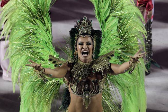A performer from the Mangueira samba school parades during carnival celebrations at the Sambadrome in Rio de Janeiro, Brazil, Tuesday, Feb. 12, 2013. 