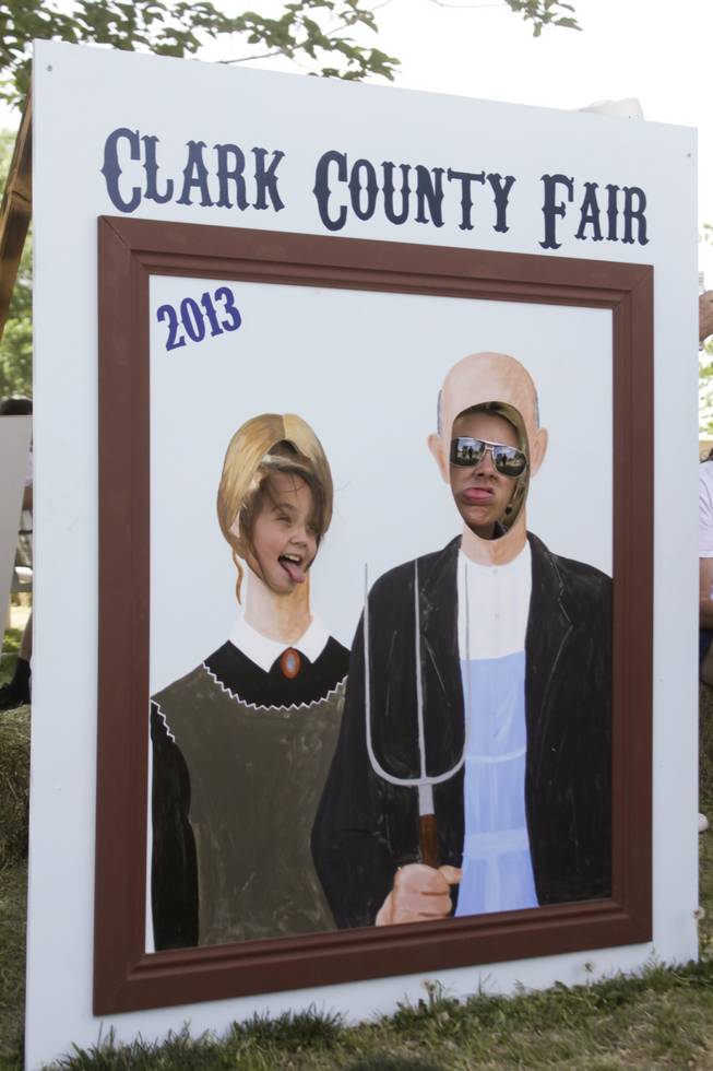 Arlene, left, and Bobbie stop to take a photo as the characters of Grant Wood's "American Gothic" painting at the 2013 Clark County Fair, Saturday, April 13, 2013.
