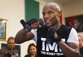 Undefeated welterweight boxer Floyd Mayweather Jr. works out at the Mayweather Boxing Club Wednesday, April 17, 2013. Mayweather will defend his WBC welterweight title against Robert Guerrero at the MGM Grand Garden Arena on May 4.