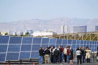 Guests and media gather as the City of Las Vegas dedicates its new three-megawatt solar panel installation Thursday, April 18, 2013.