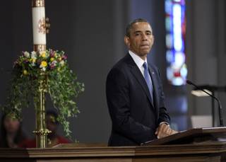 President Barack Obama pauses while speaking at the 