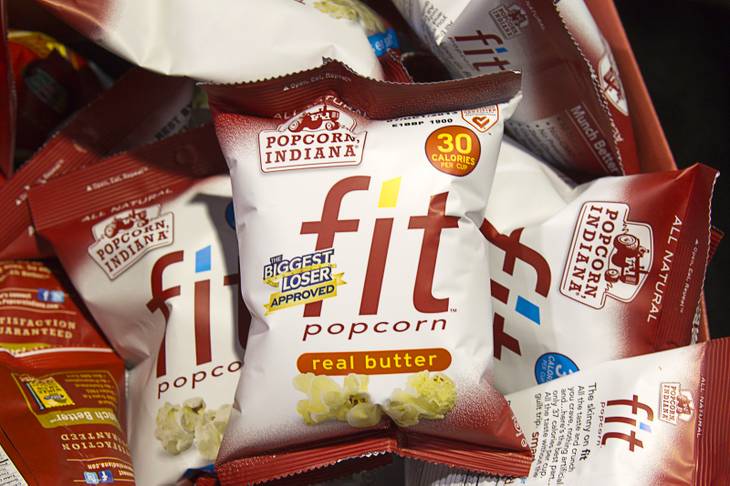 Fit Popcorn by Popcorn Indiana is displayed during the NAMA (National Automatic Merchandising Association) One Show at the Sands Expo Center Wednesday, April 25, 2013. The low-calorie snack is expected to be in vending machines in May, a representative said. The NAMA One Show convention serves the vending, coffee and food service industries.
