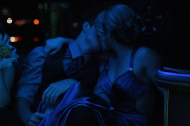 Austin Higgins and Julia Ross steal a kiss in their limo on the way to the Penn and Teller show on Green Valley High School's prom night Saturday, April 27, 2013.