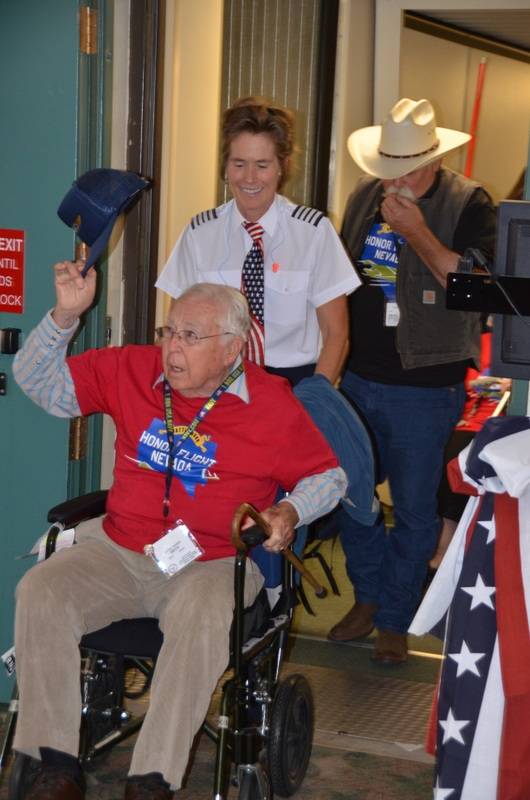 Retired Cmdr. Chuck Aikins, 92, is pushed by his daughter, a Southwest Airlines captain with 20 years of commercial flying experience. Aikins started flying for the Navy in 1938 and was a pilot on the USS Brooklyn during the invasions of North Africa and Sicily. He also was part of a fighter squad on USS Lexington in the Philippines and Western Pacific and flew more than 25,000 hours in his career.