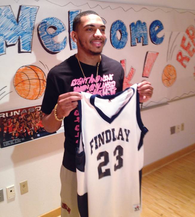 Former UNLV guard Anthony Marshall holds his jersey No. 23 from Clifford O. Findlay Middle School. The school retired his jersey May 1, 2013.