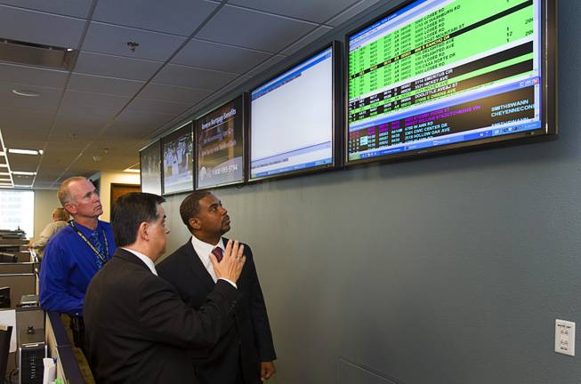 Congressman Steven Horsford (D-NV), right, takes a tour of the Southern Nevada Counter-Terrorism Center, also known as the Fusion Center, with Jim Owens, left, deputy chief of Metro's homeland security division, and Capt. Al Salinas, center director, at Metro Police Headquarters Thursday, May 2, 2013. Officials at the center are concerned that budget cuts that might negatively affect its operations.