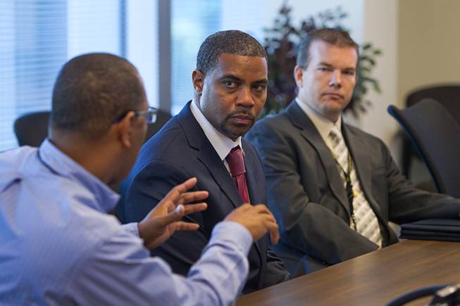 Congressman Steven Horsford (D-NV), center, listens to Assistant Sheriff Greg McCurdy during a tour of the Southern Nevada Counter-Terrorism Center, also known as the Fusion Center, at Metro Police Headquarters Thursday, May 2, 2013. Metro Lt. Jim Seebock is at right.  Officials at the center are concerned that budget cuts that might negatively affect its operations.